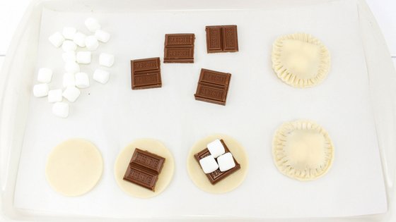 Mini smores pies are easy to make and perfect for summertime with little mess. It's like having a campfire year round with these amazing pies! #smores #pies #handpies #campingrecipe #myhomebasedlife | Pie Recipes | Hand Pie Recipes | Smores Recipes | Camping Recipes |