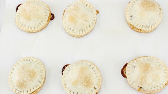 Mini smores pies are easy to make and perfect for summertime with little mess. It's like having a campfire year round with these amazing pies! #smores #pies #handpies #campingrecipe #myhomebasedlife | Pie Recipes | Hand Pie Recipes | Smores Recipes | Camping Recipes |