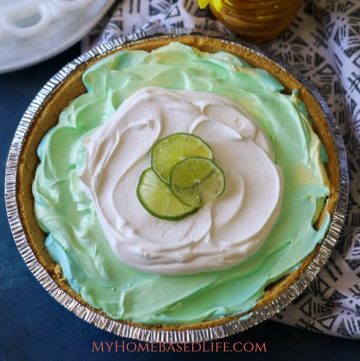 The perfect summer recipe for picnics or for just enjoying as a family. This Tye-Dye KoolAid Pie works great with Easter and Earth Day as well! #koolaidpie #pierecipe #dessert #tasty #myhomebasedlife | Pie Recipes | Dessert Recipes | Summer Recipes | Earth Day Recipe | Easter Dessert |