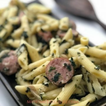 This One Pan Sausage Pasta recipe is the way to make your life easier with less mess. Mixing Sausage and Pasta with cajun seasonings, yum! #dinner #recipe #onepotmeal #easydinneridea #myhomebasedlife | Dinner Recipes | Pasta Recipes | Sausage Recipes | Easy Weeknight Meals | One Pot Meals | One Pan Dinners