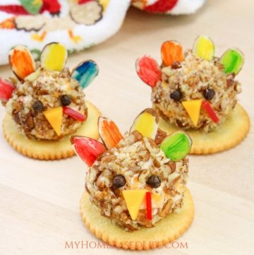 How much fun are these Turkey Cheese Ball Appetizers for the kids? Put a little fun on your Thanksgiving Tablescape this year. #thanksgiving #foodart #thanksgivingappetizers #cheeseball #myhomebasedlife | Thanksgiving Appetizers | Thanksgiving Dinner Recipes | Cheese Ball Recipes | Easy Recipes for Kids | Turkey Shaped Foods