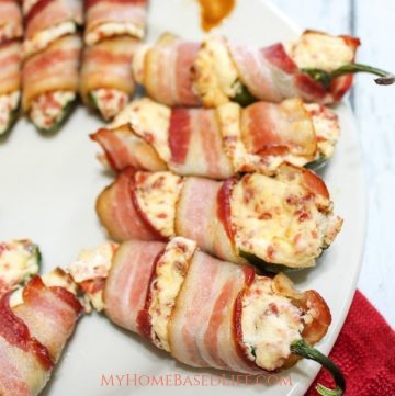 We made these delicious Kickin' Bacon Wrapped Jalapeno Poppers recently and took them up a notch with TABASCO®. Under 30 minute recipe. @TABASCO #ad #myhomebasedlife #appetizer #homegating #jalapenopoppers | Homegating Ideas | Appetizer Recipes | Jalapeno Poppers Recipes | Grab N Go Food Ideas