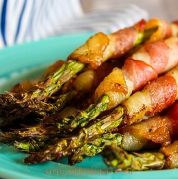 If you are looking for the juiciest recipe for Bacon Wrapped Asparagus this is it and it's made in the Air Fryer! Ready in under 15 minutes. #airfryerrecipe #airfryer #baconwrappedasparagus #sidedish #myhomebasedlife | Side Dish Recipe | Asparagus Recipe | Bacon Wrapped Foods | Air Fryer Recipes | Easy Air Fryer Recipes |